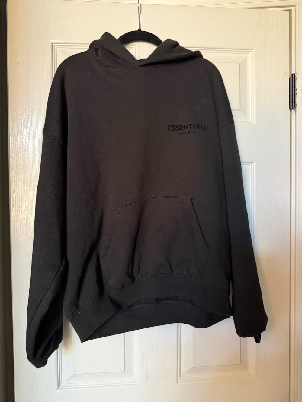 Essentials Black Pullover Hoodie with Subtle Chest Logo